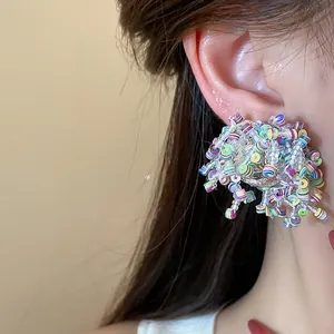 Macro detail view of vibrant colorful sequin and glass bead irregular cluster earrings