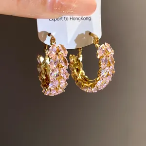 Detailed close-up of pink marquise-cut zircon wheat ear hoop earrings in gold finish