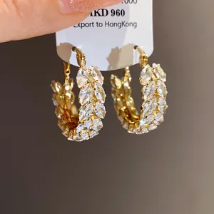 Detailed view of luxury gold hoop earrings featuring marquise-cut zirconia wheat ear design