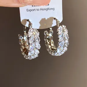 Close-up of marquise-cut zircon hoop earrings featuring a wheat ear pattern design