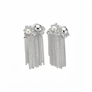 Silver tassel earrings with pearls and delicate chains for a luxury fashion look