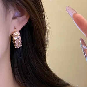Close-up of pink zircon wheat ear hoop earring showing intricate vintage details