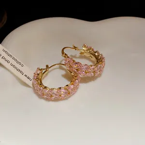 Detailed view of vintage pink zircon wheat-pattern hoop earrings in elegant gold plating