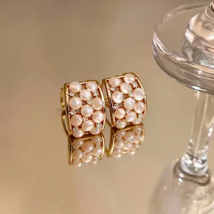 Elegant 18k gold plated hoop earrings featuring cat's eye stones and zircon accents
