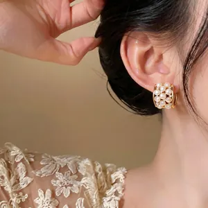Elegant 18k gold plated stud earrings with cat's eye stones and zircons
