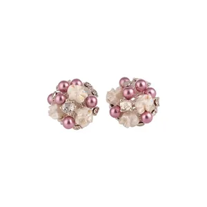 Elegant floral stud earrings with purple pearls and rhinestones on white background
