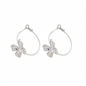 Elegant silver butterfly hoop earrings with sparkling white and blue zircons for women.