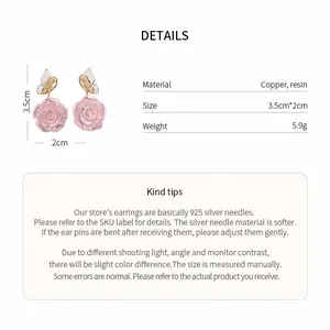 Detailed view of pink rose and butterfly earrings with material and size information