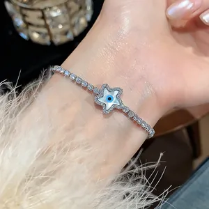 Close-up of 18k gold plated zircon bracelet featuring a star-shaped evil eye charm