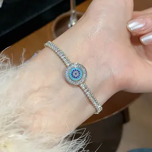 Close-up detail of 18k gold plated zircon bracelet with sparkling evil eye motif