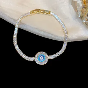 Detailed close-up of an 18k gold plated zircon bracelet featuring a blue evil eye motif