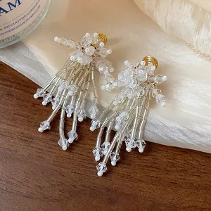 Close-up of sweet glass flower tassel clip-on earrings with delicate transparent beads
