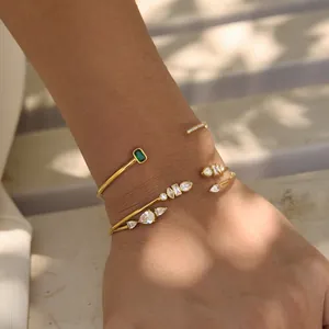 Elegant 18k gold plated stainless steel bracelet set with zircons on a woman's wrist