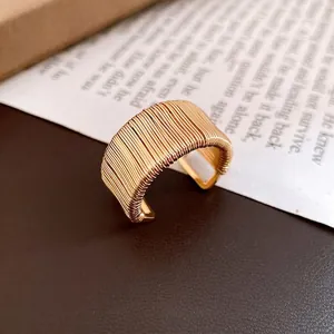 Vintage gold woven wide band open ring with a unique multi-layer wire wrapped design