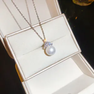 Close-up detail of an elegant round pearl necklace with sparkling zircon accents