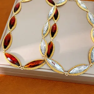 Close-up of vintage marquise-cut colorful crystal necklace in gold-tone beaded setting