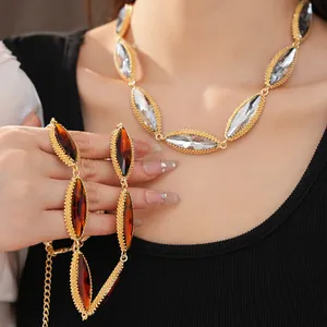 Close-up of vintage palace style necklaces with marquise crystals and gold beaded edges.