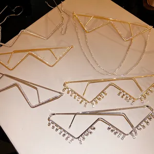 Macro detail of geometric metal rhinestone glasses frames in gold and silver finish