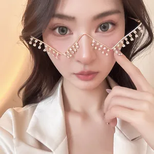 Avant-garde metal glasses frame with hanging rhinestone tassels on Asian female model