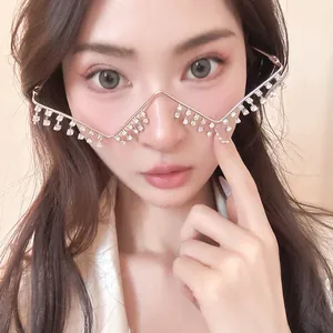 Close-up detail of silver metal lensless glasses frame with sparkling rhinestone tassels