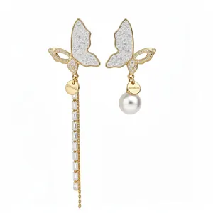 Asymmetric 14k gold plated butterfly earrings with pearl and crystal chain dangles