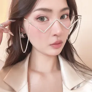 Close-up view of a unique silver metal rhinestone glasses frame worn by a female model