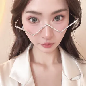 Close-up of a trendy zigzag metal glasses frame with rhinestones, no-lens fashion accessory