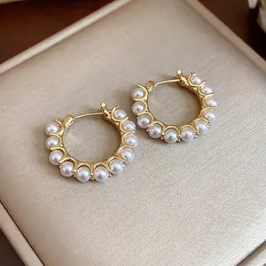 Elegant 14K gold plated pearl hoop earrings with a minimalist French design style