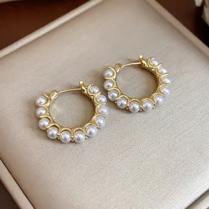 Elegant French style 14k gold-plated hoop earrings featuring a row of delicate white pearls.