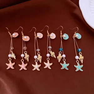 Bohemian ocean theme drop earrings with starfish, pearl, and seashell charms in multiple colors.