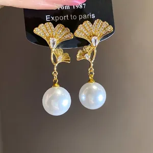 Elegant 18K gold plated ginkgo leaf dangle earrings with sparkling zircons and large pearls
