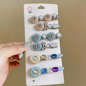 Sweet resin floral and rhinestone bowknot hair clips set on display card