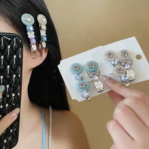 Detail shot of sparkling resin flower hair clips with bowknot and crystal rhinestones