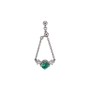Vintage silver chain ring featuring a round green zircon and sparkling side stones