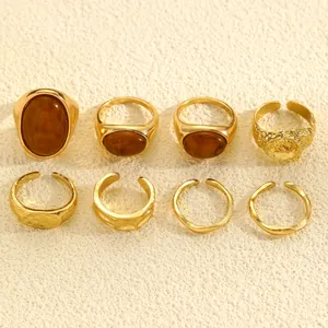 Detailed view of 8-piece vintage gold-tone ring set with irregular hammered textures