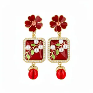 Elegant red flower pendant earrings with pearl and gold accents in retro court style.
