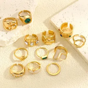 Detailed view of vintage gold ring set with irregular textures and colorful gemstones
