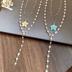 Elegant pearl beaded flower necklace set with yellow and blue enamel flower pendants