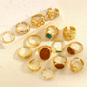 Detailed set of vintage gold-plated rings with irregular textures and assorted gemstones