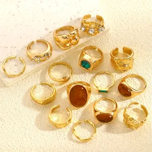 Detail view of 14 vintage gold rings with irregular textures and faux gemstones