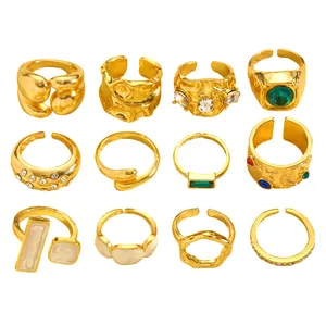 Set of 12 vintage gold-colored rings with irregular textures and stone accents