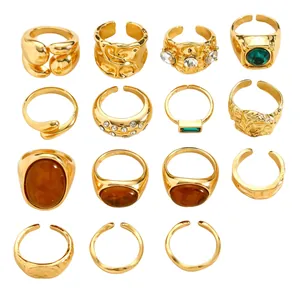 Macro view showing 15 pieces of vintage gold-toned rings with irregular textures