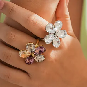 Close-up of luxury crystal flower open rings on hand showing intricate petal details