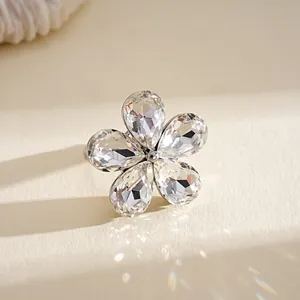 Close-up detail of a sparkling crystal flower open ring with rhinestone petals