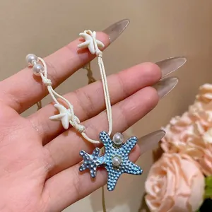 Bohemian summer vacation blue starfish pendant necklace with pearls on white cord