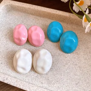 Chic drip oil wrinkled oval stud earrings available in pink, blue, and white colors.
