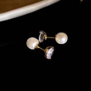 Detailed view of elegant two-way gold stud earrings featuring white pearls and zircons.