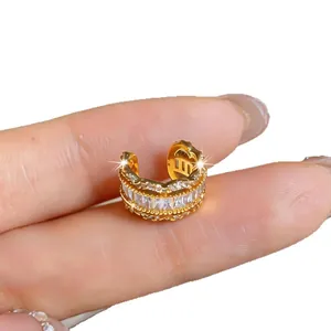 Elegant gold C-shaped ear cuff with sparkling zircon stones for non-pierced ears.