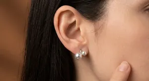 Elegant French vintage geometric pearl hoop earrings featuring two lustrous pearls