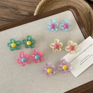 Set of vibrant dopamine-colored hollow flower stud earrings in multiple pastel shades.